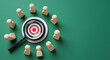 © StockWorld - Target Audience: Finding Your Ideal Customer. Target, Magnifying Glass, Wooden Figures on Green Background. Marketing, Business, HR.