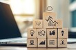 © Chodas - Stacked wooden blocks with business icons