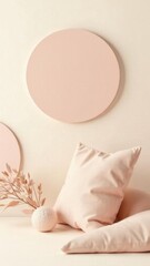 Poster - A minimalist corner showcases soft pink pillows and decorative round shapes on the wall complemented by delicate dried flowers evoking tranquility and inviting relaxation.