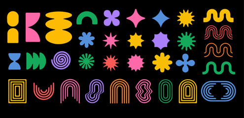 Fototapete - Vibrant collection of abstract geometric shapes in bright colors against a black background, including stars, spirals, and curves, arranged in a playful, modern grid pattern.