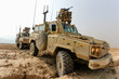 © Boris - Military Vehicles on Patrol in a Desert Terrain for Security Operations