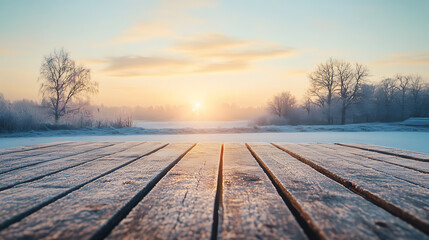 Poster - Empty wooden tabletop with a frosty winter landscape and sunrise in the distance