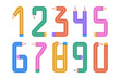 © warmjuly - Set of numbers  formed by colorful pencils on a white background.