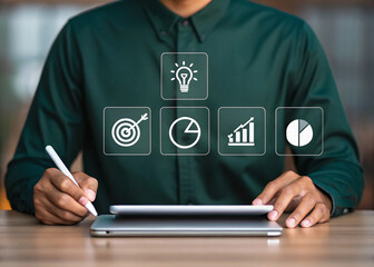 Fototapete - A person using a stylus with a laptop and tablet for digital interaction. Business professional engaging with virtual interface on devices. Technology and data analysis concepts shown through digital 