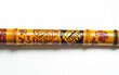 © Hassan - Exquisite Bamboo Flute Decorated with South Sea Islander Motifs Isolated On White Background.