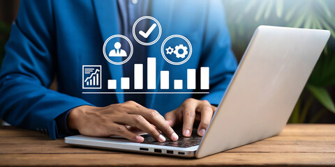Poster - Professional businessperson working on a sleek laptop with digital icons. Modern workspace concept with business analytics and productivity tools. Close-up of hands typing on laptop with overlay of bu