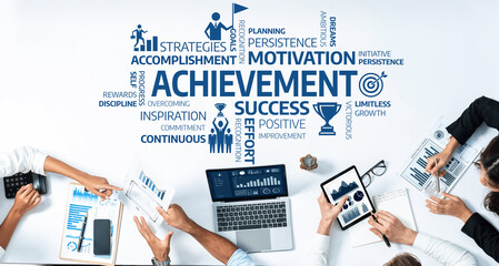 Poster - Diverse team members engage in a collaborative business meeting focusing on achievement and motivation. They analyze data and exchange insights to drive success and improvement. Amity
