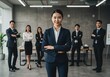 © mamun - A confident young businesswoman leading her successful team, radiating power and unity in a modern office setting with soft lighting.