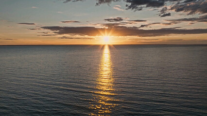 Wall Mural - sunset over an ocean.