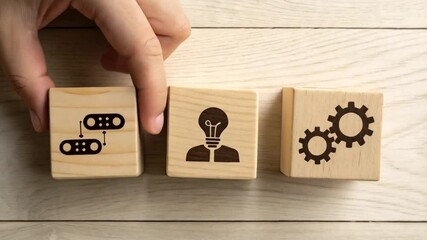 Aufkleber - Hand arranging wooden blocks with data, idea and gears icons on a light wooden surface viewed from above