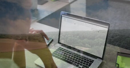 Poster - Using laptop with code overlay, person working with animation on scenic landscape