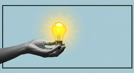 Poster - Greyscale Hand Holding a Glowing Light Bulb Against a Light Blue Background Representing Inspiration