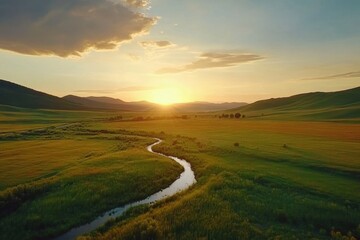 Poster - Sunset glow lights up beautiful valley fields and winding river during golden hour, Sunset glow over beautiful fields of valley - majestic drone shot