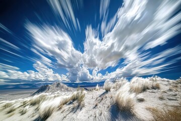 Poster - Clouds move rapidly over a desert mountain range in a time-lapse captured under a bright blue sky, Time-Lapse of clouds over a desert mountain range in California