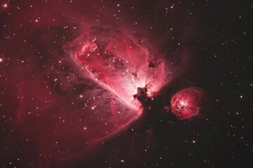 Wall Mural - vibrant nebula glowing in red with star formation visible in the cosmos at night