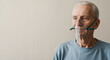 © Vasiliy - Senior man with oxygen mask against neutral background. Medical respiratory support equipment for elderly care and pulmonary disease treatment