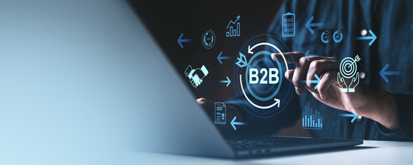Poster - B2B technology concept with icons and businessman using laptop on dark background.