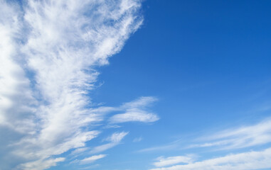 Wall Mural - beautiful blue sky with soft white clouds for abstract background