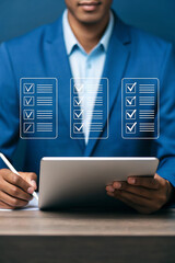 Poster - Professional using digital devices for data management. Businessperson interacting with laptop and tablet in blue suit. Futuristic tech workspace with digital overlay graphics.