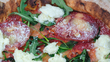 Poster - A pizza with cheese and spinach on top. cheese is melted and the spinach is fresh. pizza is topped with pepperoni and cheese