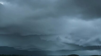Wall Mural - A Stormy Sky: Captivating image of a dark, dramatic sky filled with ominous, rain-laden clouds, conveying the power and raw beauty of nature's atmospheric display.