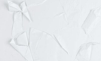Poster - Crumpled white paper background creates textured and artistic feel, perfect for various design projects and presentations. subtle shadows add depth and interest