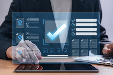 Leinwandbilder - Digital certification and approval workflow with large blue checkmark interface, highlighting document verification, task tracking, and process management in corporate environment using smart devices