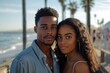 © Baba Images - Portrait of a young African American couple on the boardwalk in Los Angeles
