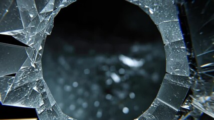 Poster - A Close-up View of a Shattered Glass Window with Sharp Edges and Fragmented Pieces, Capturing the Texture and Depth of Broken Surface