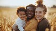 © HISTOCK - Young multiracial family is savoring a balmy summer evening in a wheat field