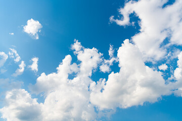 Wall Mural - Sky clouds background. Blue Heaven and white clouds. White cloudy Heaven with soft sun light. Clouds on pastel blue sky background. Sky Landscape Background. Sky Clouds Wallpaper.