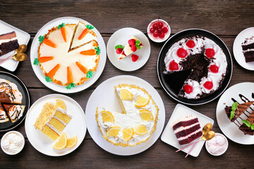 Poster - Dessert table scene with an assortment of cakes. Top view over a dark wood background. Black forest, lemon, carrot, red velvet, chocolate and cheesecakes.