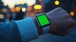 © Thiga.project - Close-up of a smart watch with a green screen on the wrist, against a blurred background