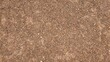 © Kawee - Brown small stone floor texture background. Rural roads or pavements are used for travel. Close-up aerial view of rough brown soil with no vegetation.
