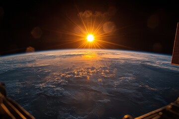 Fototapete - Sunrise over Earth viewed from space showcasing clouds and the curvature of the planet during the early morning light