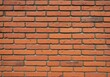 © Md Rabiul Islam - Close-up of brick wall texture with red clay bricks and weathered appearance