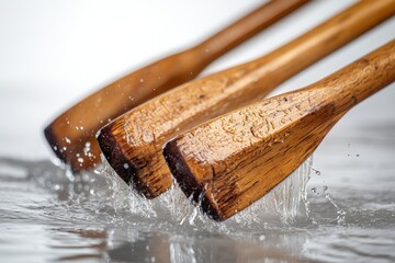 Poster - Water flows rapidly over a wooden surface, creating splashes and droplets in a well-lit environment during the day, capturing the beauty of natural movement and texture