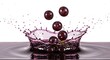© Feb - Grapes Falling Into Liquid Create Splash on White Background