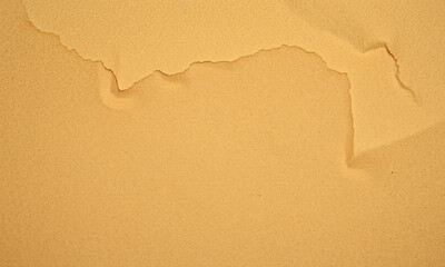Poster - Kraft paper texture with torn edge, showcasing warm beige color and smooth surface. This evokes sense of simplicity and natural beauty, perfect for various creative projects