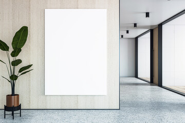 Poster - Blank vertical canvas mockup in modern office interior with wooden wall, indoor plant, and corridor view for poster or banner presentation.. 3D Rendering