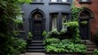 © Puttipong - Elegant townhome unit with dark gray exterior and lush green hedges.