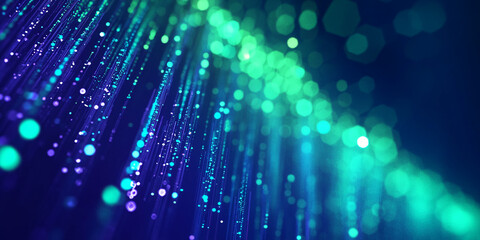 Abstract image of blue and green light streaks and bokeh, creating a dynamic and vibrant visual effect, representative of technology, energy, or innovation