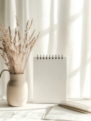 Poster - Modern desk calendar with blank grid and neutral tones, featuring soft sunlight filtering through curtains and a dried floral arrangement