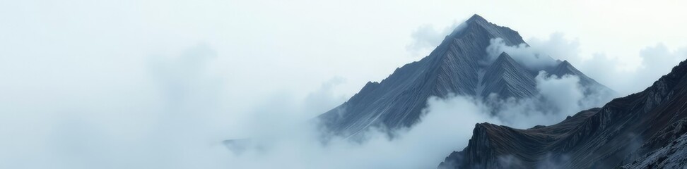 Wall Mural - Grey mist-shrouded rocky peak with white wispy clouds, rocky, grey, misty