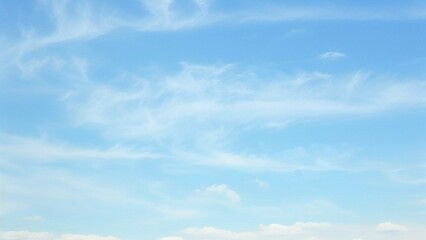 Wall Mural - light blue vault of heaven, filmy clouds wandering. the light blue sky is pure and vast. a few filmy