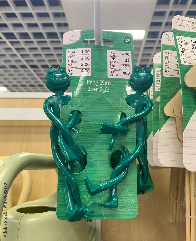 Green plastic frog-shaped plant ties by Wilson & Gregory on display in ...