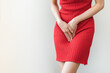© KMPZZZ - Vaginal, urinary incontinence. Pain asian young woman hand holding crotch suffering from pain, itchy or scratch of vagina, genital itching from infection. Gynecological problems menstrual disorder