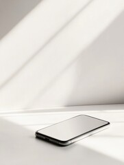 Leinwandbilder - Modern smartphone resting on clean white surface with soft lighting in a minimalist aesthetic environment