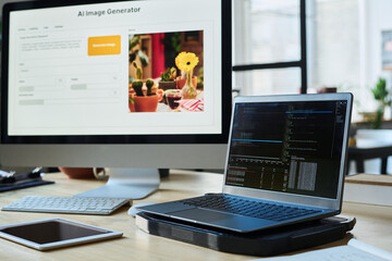Fototapete - Screen of laptop with coded data and tablet standing next to computer with image generator on desk in company office