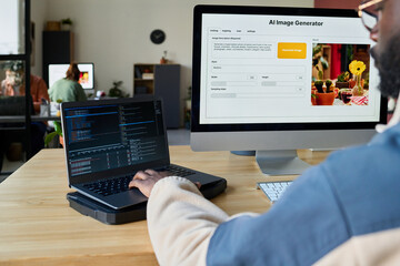 Aufkleber - Focus on two desktop computers and hand of young male programmer typing on laptop keypad while decoding data